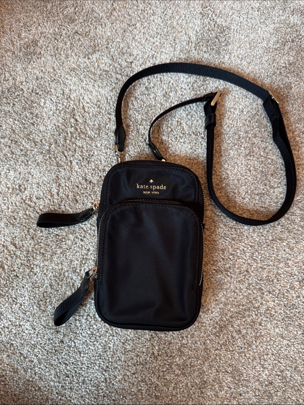 kate spade black nylon crossbody phone pouch with gold logo